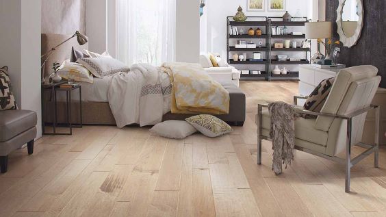 refinished hardwood floors in a bright bedroom